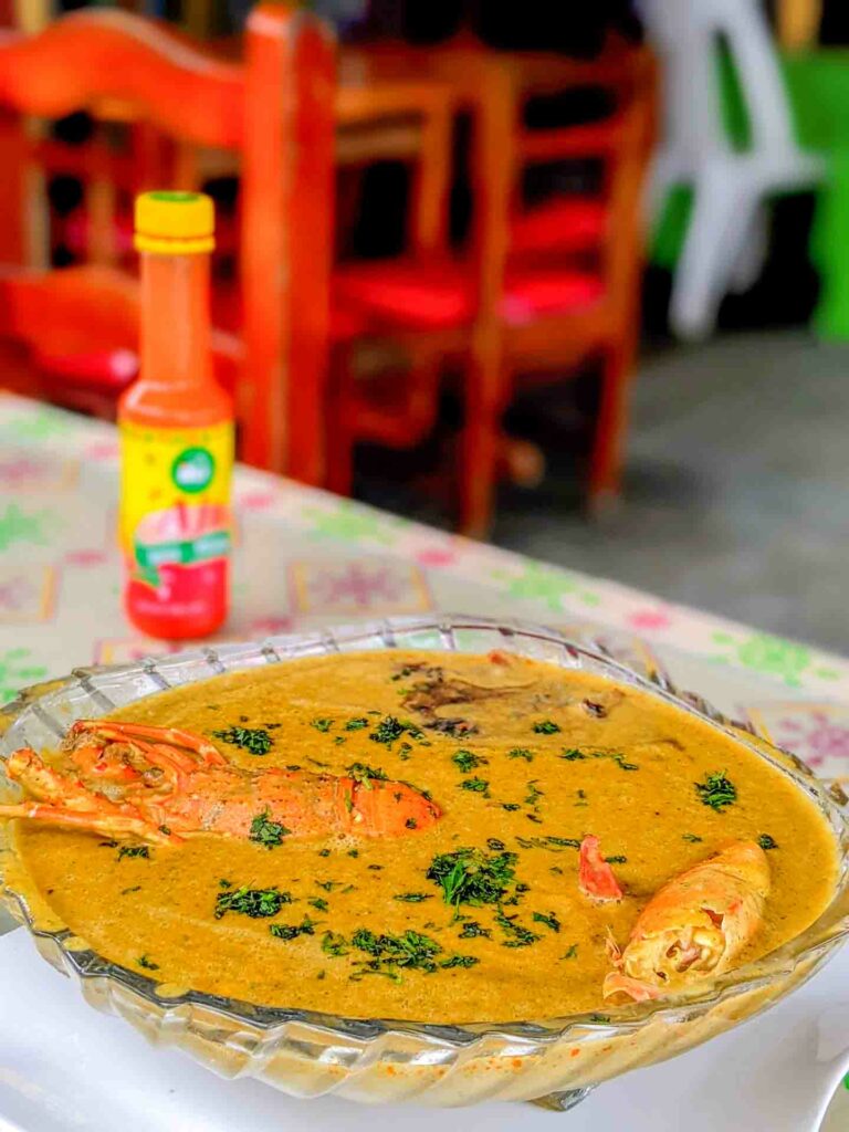 ensumacado seafood soup with peanut in a glass bowl on a table in Esmeraldas Ecuador