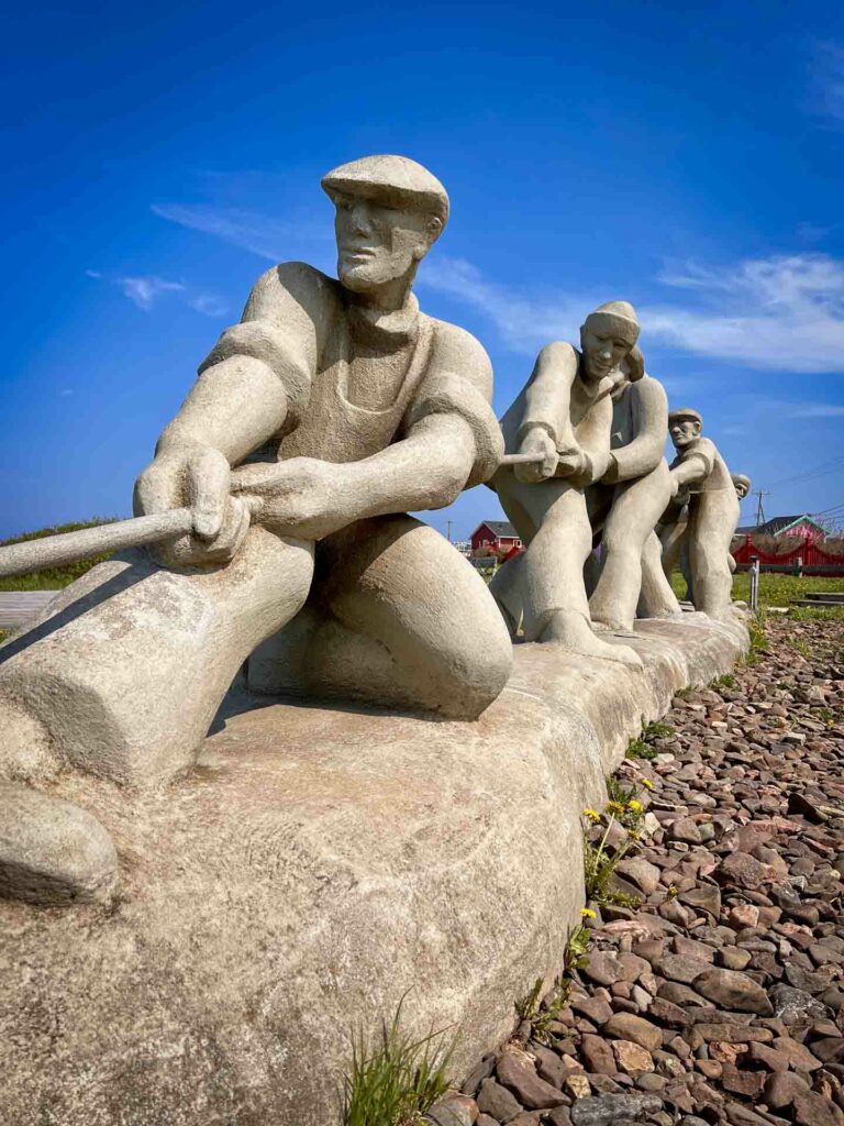sculpture of fishermen at L'etang du nord magdalen islands