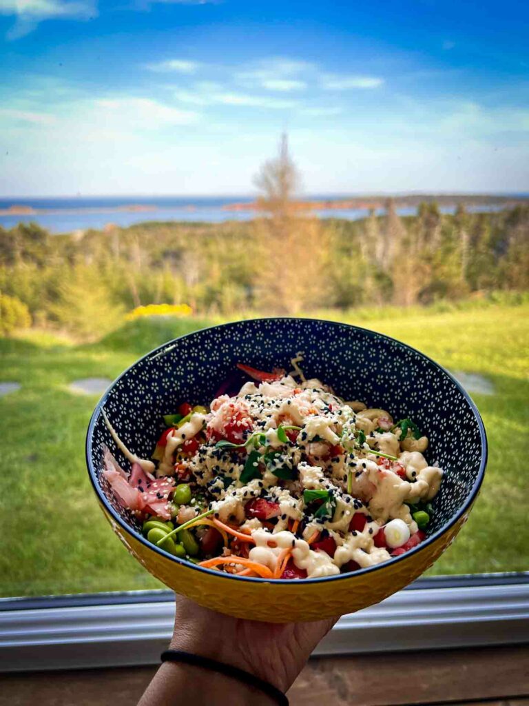 Auberge la salicorne lobster poke in woman's hand Magdalen Islands