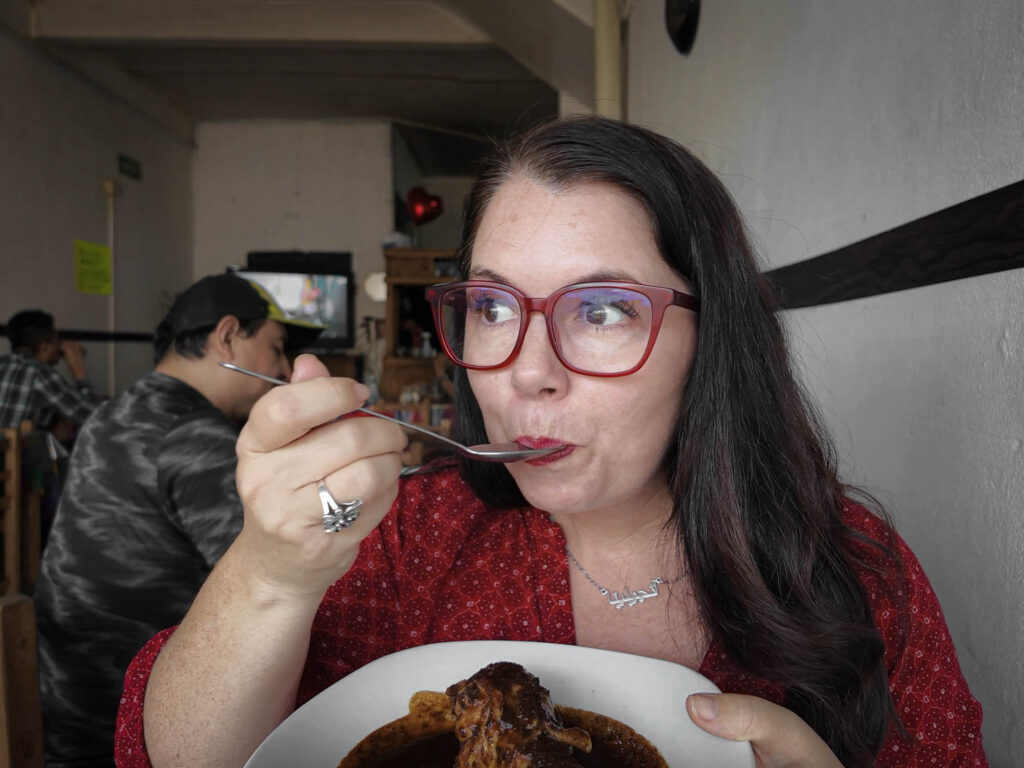 Ayngelina eating mole in Puebla
