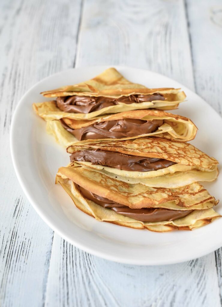 Crepes with chocolate cream close up