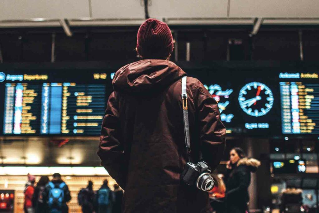 Person looking at airport digital board