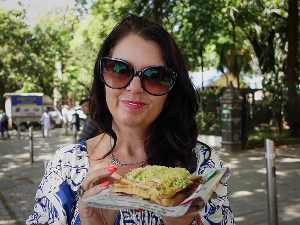 Ayngelina eating Bombay sandwich a famous Mumbai street food