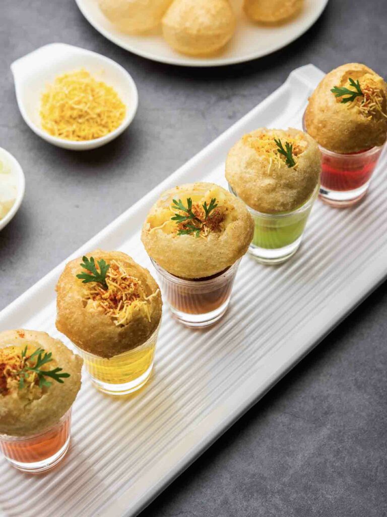 Panipuri shot or different flavours of water served in small glasses