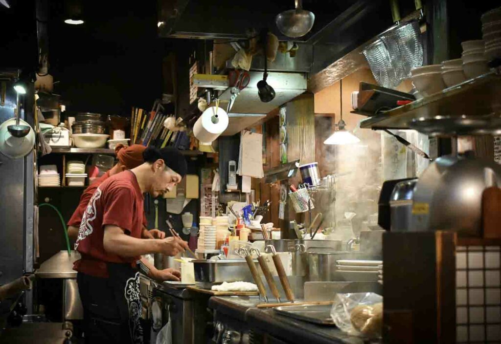 Japanese kitchen with people making food