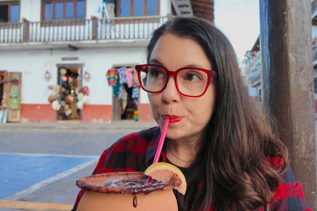 Ayngelina drinking cantarito traditional drink in Jalisco