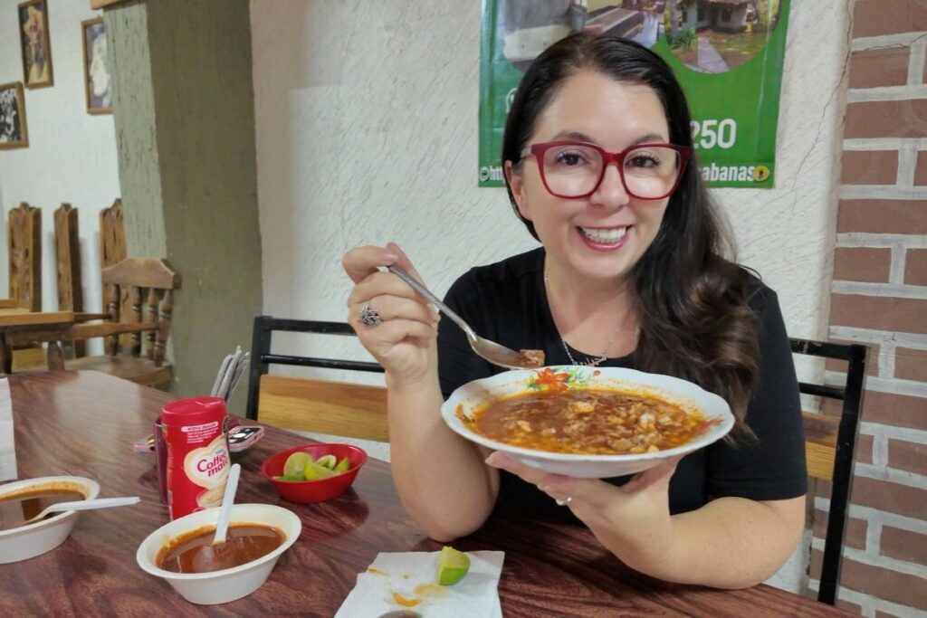 Ayngelina eating Birria de chivo at Birria Irma Isabel Mercado Mazamitla