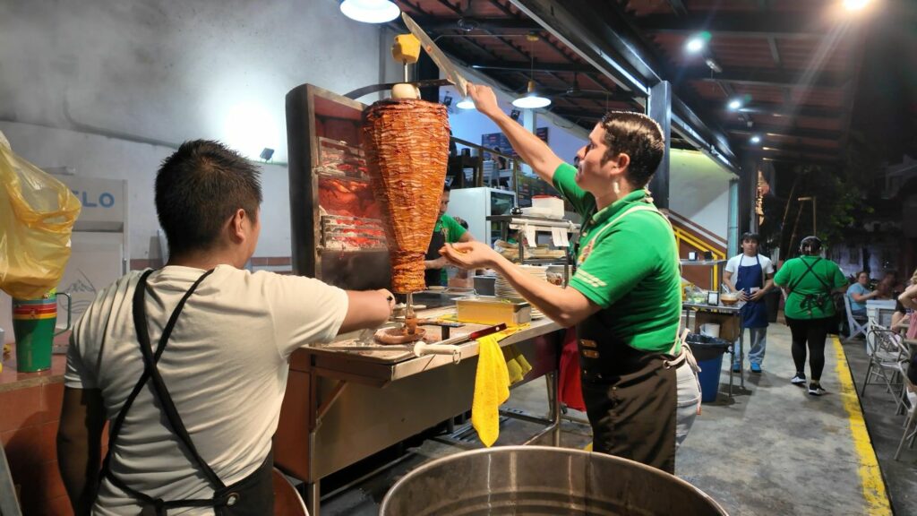 Famous Sayulita Tacos spot Tacos Al Pastor Diaz cutting meat off the trompo