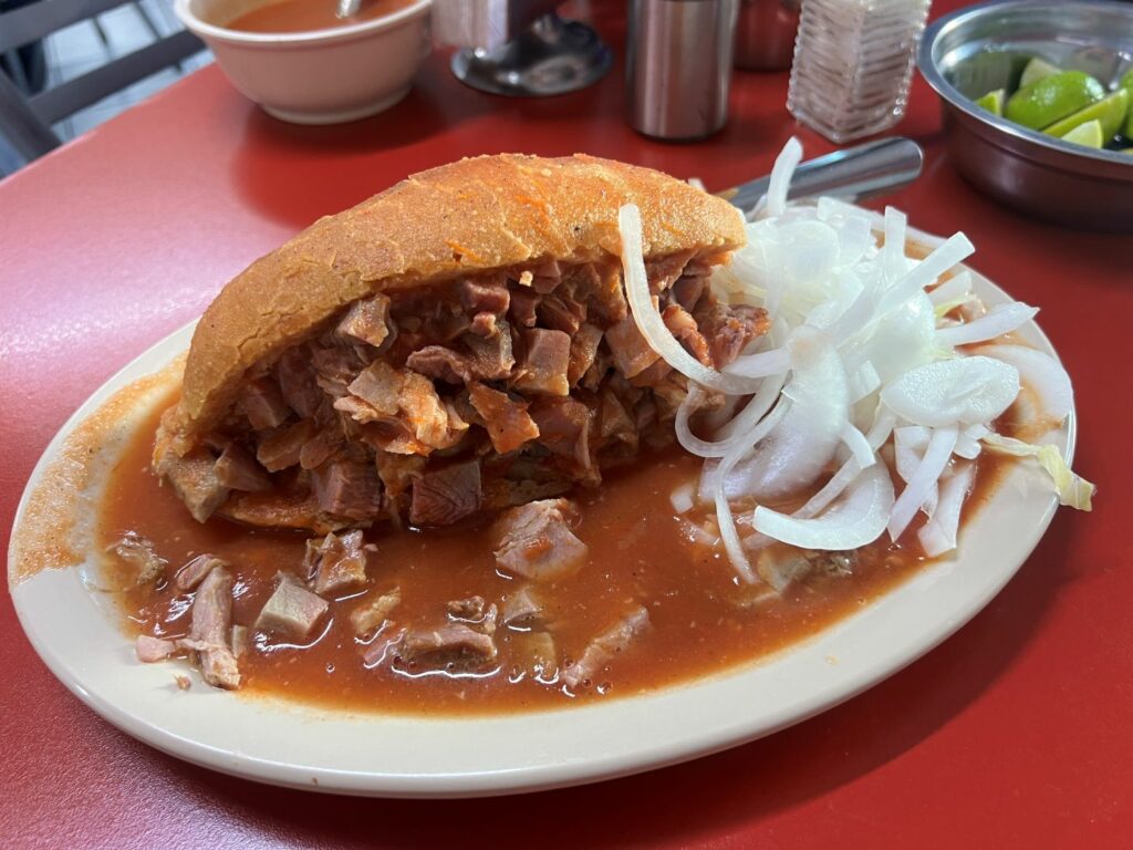 Torta ahogada at Guadalajara restaurant on red table