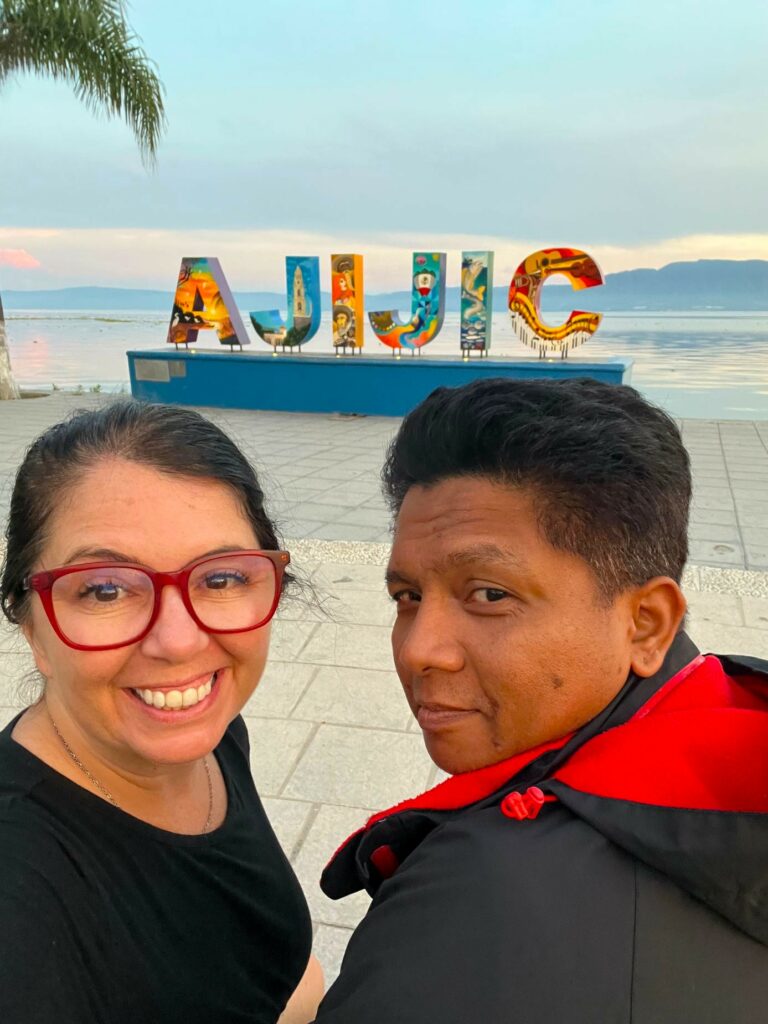 Ayngelina and Alan in front of Ajijic sign on Lake Chapala waterfront