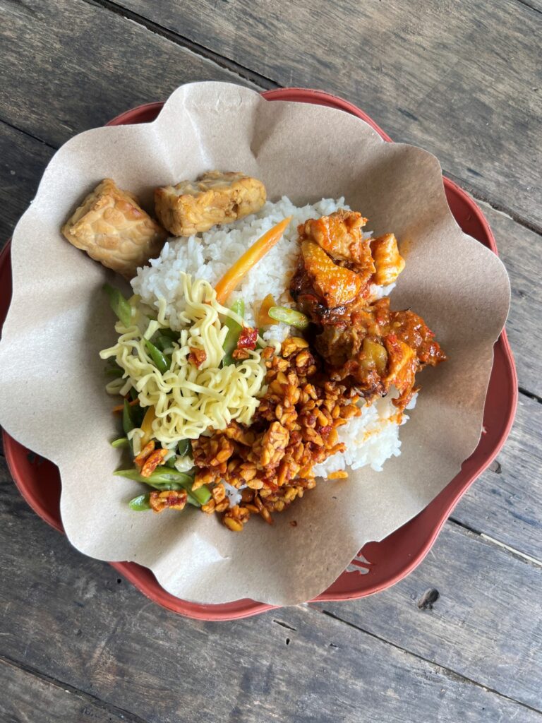 Rustic wooden table with Nasi Balap Puyung from Lombok Indonesia
