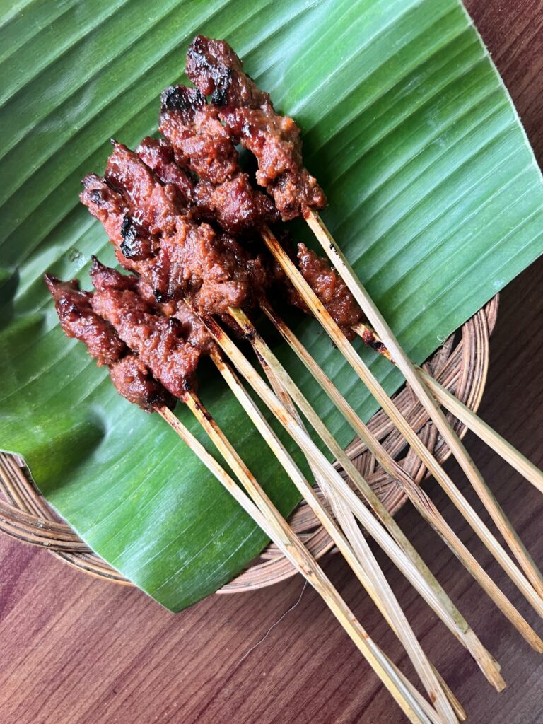 Sate Rembiga traditional food from Lombok on a banana leaf