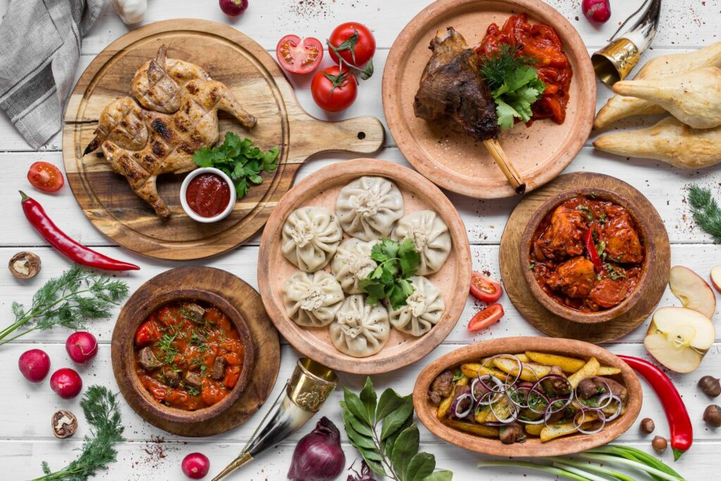 Traditional Georgian food laid out on table on white background