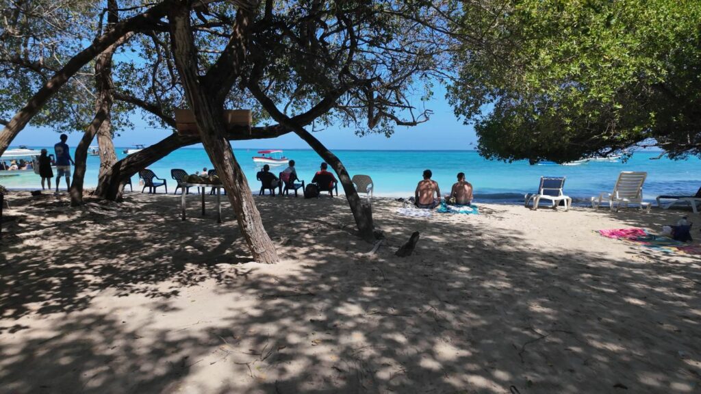 Rosario Islands Playa Libre people sitting in shade
