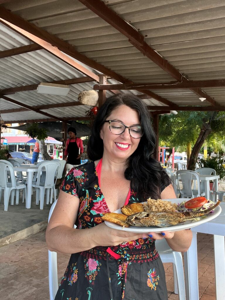 ayngelina with pescado frito at restaurant on Taganga beach