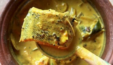 Jaffna fish curry Meen Kulambu) a traditional Sri Lankan dish in a clay bowl