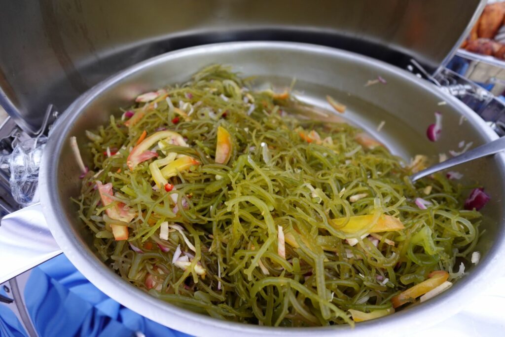 Filipino seaweed salad in a buffet serving tray