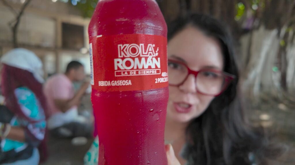 Kola Roman a popular Cartagena drink similar to cream soda with Ayngelina in the background