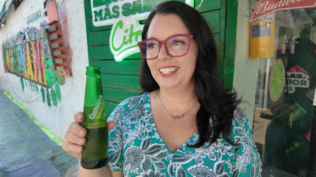 Ayngelina drinking costena beer in Cartagena