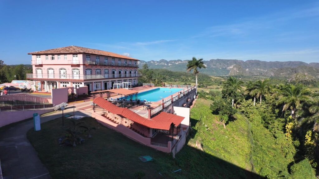 The Jazmin hotel in Vinales with pool looking onto farmland and the mogotes