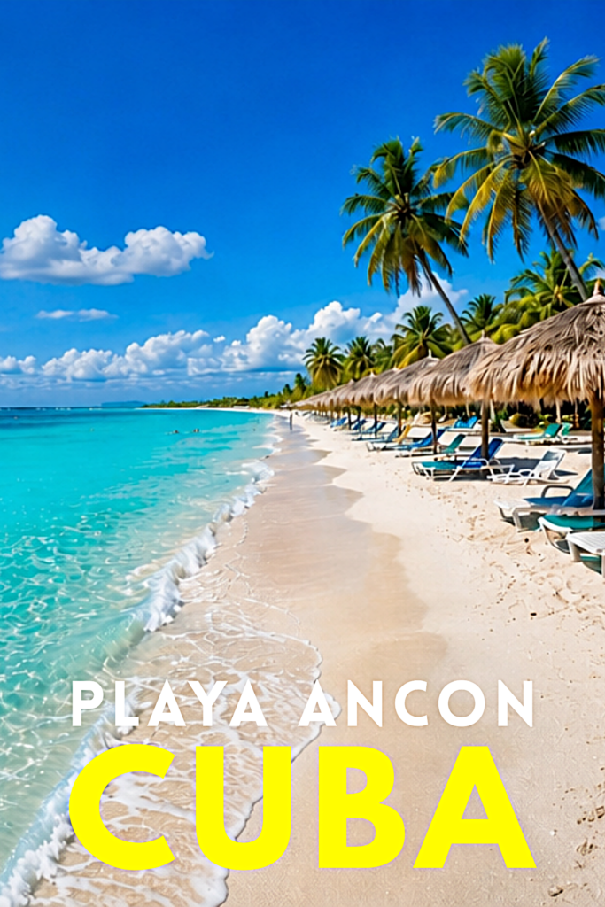 Playa Ancon Cuba Beach with guanos or palapa palm umbrellas lining the beach and turquoise water