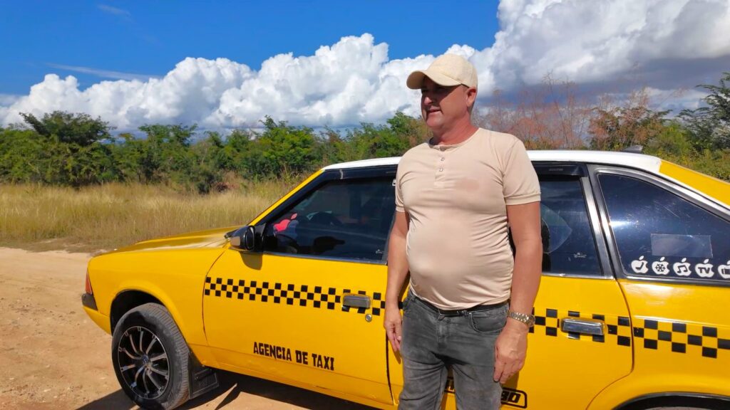 Trinidad Cuba taxi driver waiting at Playa Ancon