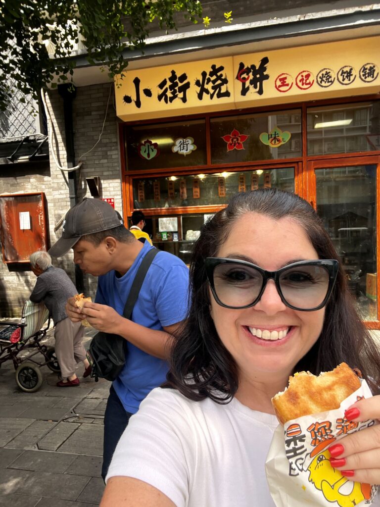Ayngelina and Alan eating from bakery in Beijing China