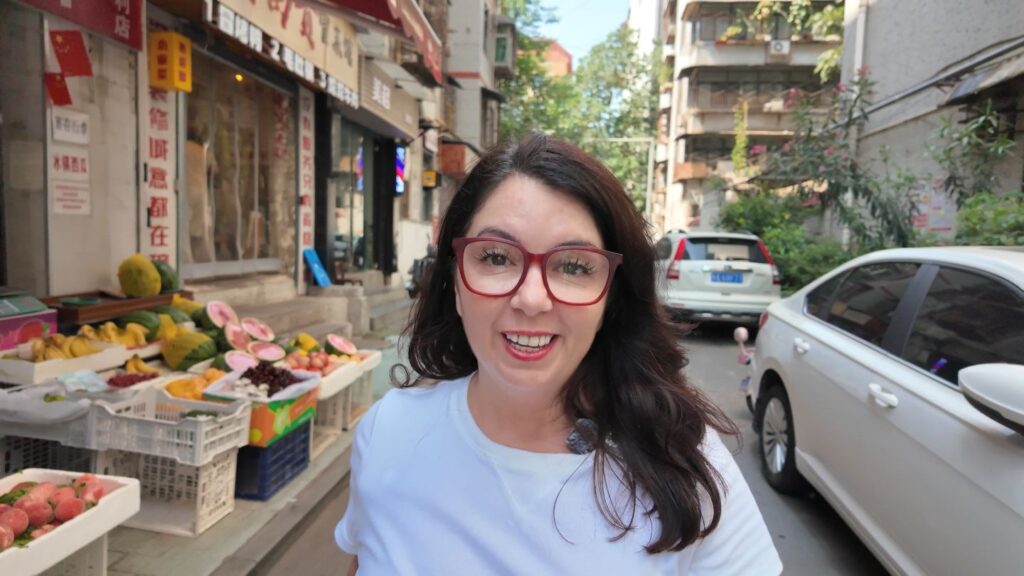 Ayngelina smiling walking in China street