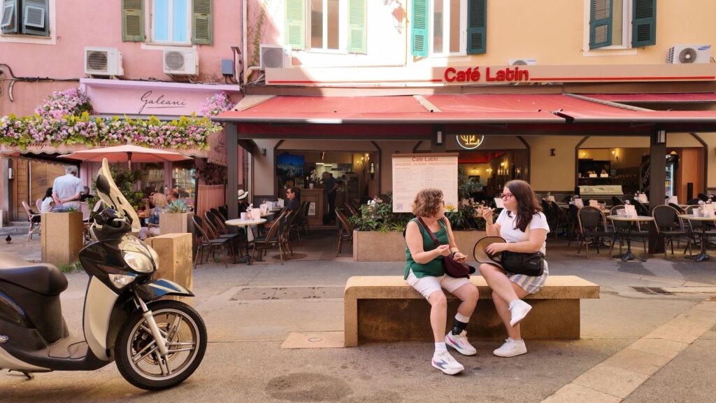 Ayngelina and Carmie in Ajaccio eating pastry