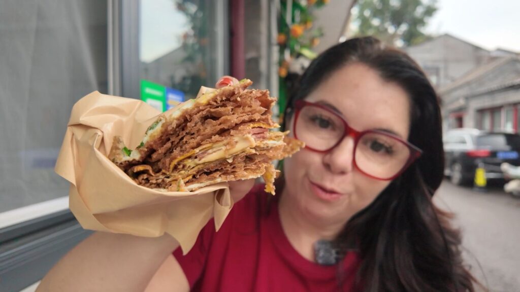 ayngelina holding Chinese pancake Jianbing